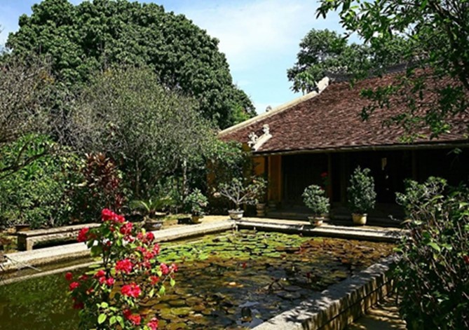 Hình 5: Nhà vườn An Hiên, Huế (An Hien Garden House, 2026), kiến trúc trung tâm được bao bọc bởi cảnh quan.