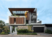 Toàn cảnh mặt tiền Diamond Villa sau khi hoàn thiện, với hệ mái đua rộng, các khối kiến trúc đan xen và cảnh quan nhiệt đới.